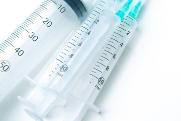 Syringes. Medical equipment. Pharmacy. Medical products. Syringes of different volumes. Medicinal syringes lie on the table. Concept - vaccination. Sale of medicines. Production of medical devices.