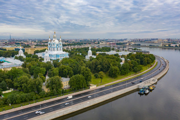 Fototapeta na wymiar Saint Petersburg. Cathedrals of Russia. Smolny Cathedral. Panorama of St. Petersburg. Neva River. Highway in St. Petersburg. Smolny Cathedral aerial view. Tours of the temples of Russia. Russia road