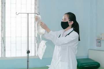 a female doctor showing how to dialysis