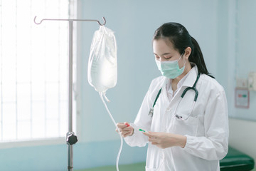 a female doctor showing how to dialysis