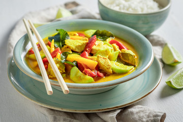 Tasty yellow curry with chicken, vegetables and rice