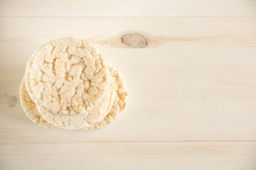 Pile of three puffed rice cakes isolated on white.