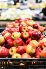 In the store a counter or a showcase with fruit apples.