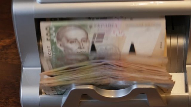 Currency counter Credit and deposit offer. Currency exchange, banking. Automated banking equipment for counting paper money. Currency counter Credit and deposit offer. Currency exchange, banking. Busi