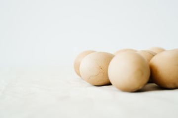 Seven Easter eggs trendy pastel colored with cracks lie on the table on a light tablecloth. minimal style. easter concept.copy space for text