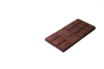 Beautiful milk chocolate lies on a white background