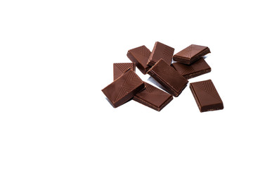 Beautiful milk chocolate lies on a white background