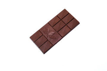 Beautiful milk chocolate lies on a white background