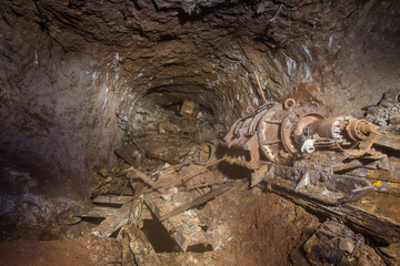 Underground bauxite mine tunnel with collapsed roof