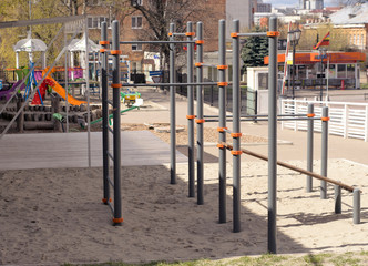 Fototapeta na wymiar Playground without people no children. Ban on playgrounds. Prevention of coronavirus COVID-19. The fight against the virus. There are no children in the playground in the yard.