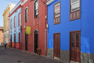 Fototapeta na wymiar Colorful facades of old houses on the street of the historical La Laguna town, Tenerife, Canary Islands, Spain.
