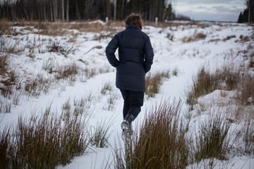Girl in the winter in the field
