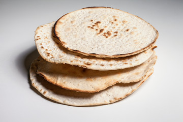 handmade Easter matzoh on a white background. Passover holiday