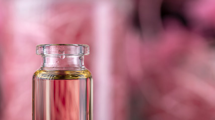 Blend of essential oils closeup. Making some aroma liquids, perfume. Drops falling from pippet to...