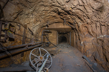 Underground abandoned bauxite ore mine tunnel with doors