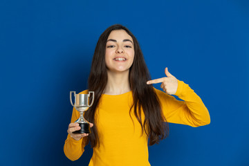 Brunette young girl wearing yellow jersey