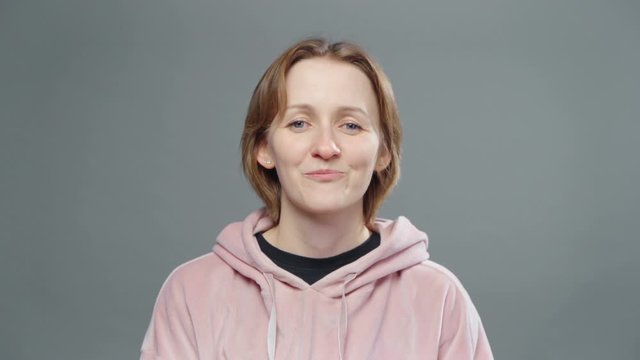 Shooting of plotting woman in pink sweatshirt