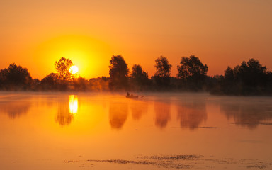 Obraz premium angler fishing on a boat in the morning