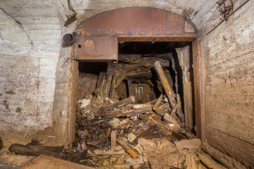 Fototapeta na wymiar Underground abandoned bauxite ore mine tunnel with doors