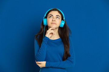 Brunette young girl wearing blue jersey