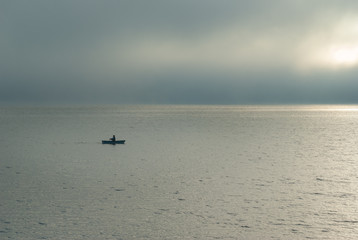 Fototapeta premium boat on the lake on a foggy morning