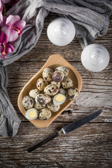 Quail eggs on a wooden table.