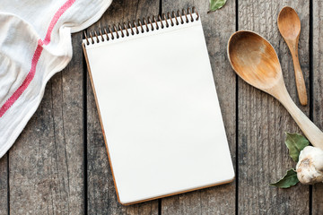 Blank recipe cooking book and utensils. Top view with copy space