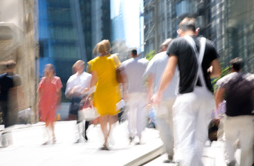 Lots of business people walking in the City of London. Blurred image of the road with people at...