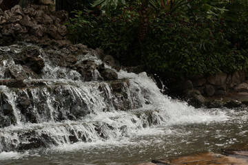 Waterfall cascading through the bushes