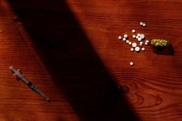 
Choose between injections and pills
Oral contraceptives, emergency pills, injectable contraceptives.
Syringe, medicines on the table