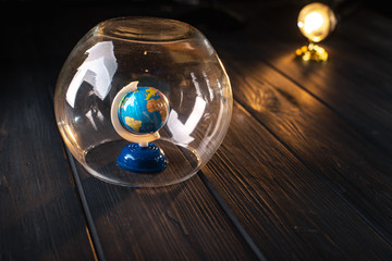 Earth under a glass bell. Quarantine, pandemic concept in the world COVID-19