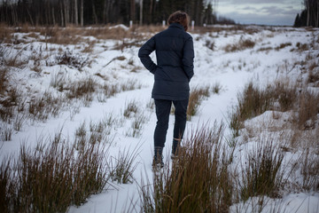 Girl in the winter in the field