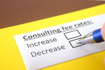 Obraz premium One person is answering question about consulting fee rates.