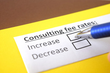 Obraz premium One person is answering question about consulting fee rates.