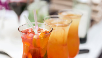 cocktails in the bar in glass glasses close up