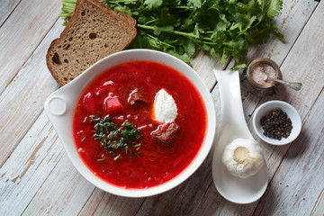 Traditional Ukrainian Russian borscht . Bowl of red beet root soup borsch with white cream . Beet Root delicious soup . Traditional Ukrain food cuisine 