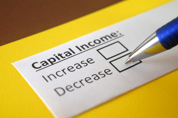 Obraz premium One person is answering question about capital income.