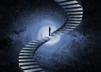 Man thinking in front of an impossible staircase