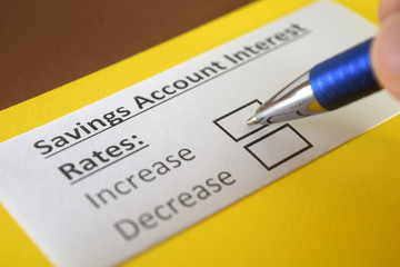 Obraz premium One person is answering question about savings account interest rates.