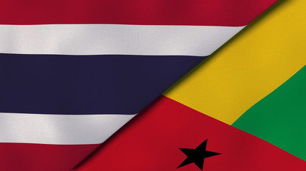 The flags of Thailand and Guinea Bissau. News, reportage, business background. 3d illustration
