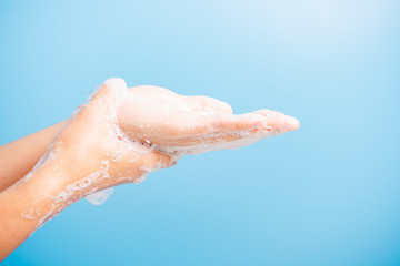 woman washing hands with soap have foam