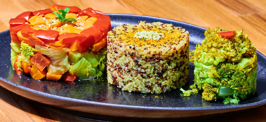 Vegan quinoa with curry and rosemary, with broccoli carrots leek celery and peppers 
