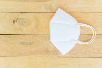 White N95 Mask on wood plate