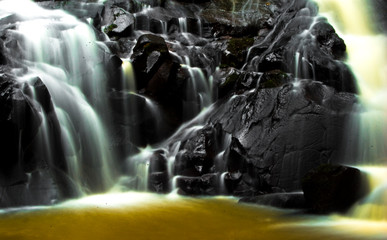 water flowing from the waterfall