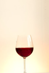 splash  of red wine on a orange background