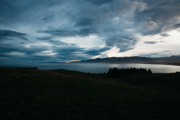 Naklejka na ściany i meble Dramatic clouds over the coast of New Zealand 