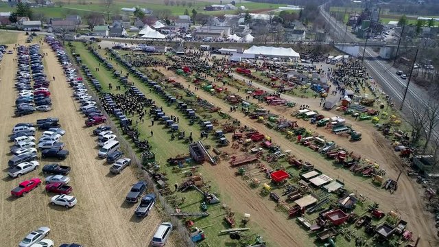 Aerial View of an Amish Mud Sale Auctioning Buggies, Farm Equipment to Quilts on a Winter Day