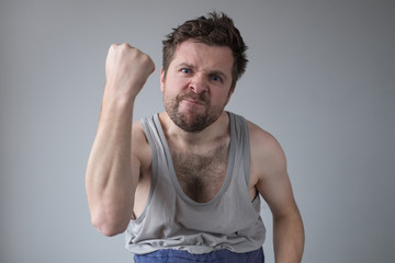 aggressive man showing his fist. Domestic violence and harassment during staying home