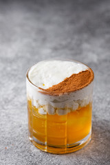 orange negroni whipped cream garnished with cocoa powder. cocktail bar menu concept.