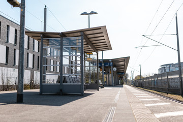 Deserted sunny trainstation, empty seats, in Rahlstedt